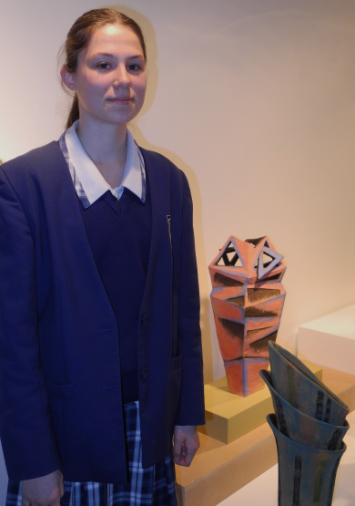 Alana Thomas with her ceramic art creation.