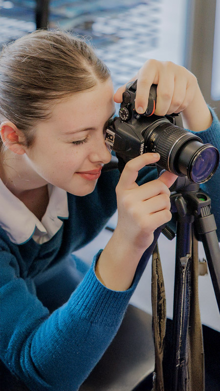 Caroline Chisholm Catholic College Glenmore Park student using camera