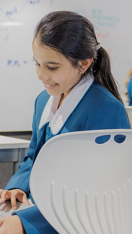 Caroline Chisholm Catholic College Glenmore Park students using learning devices
