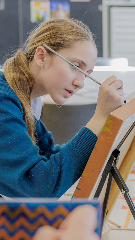 Art class at Caroline Chisholm Catholic College Glenmore Park. Students are painting