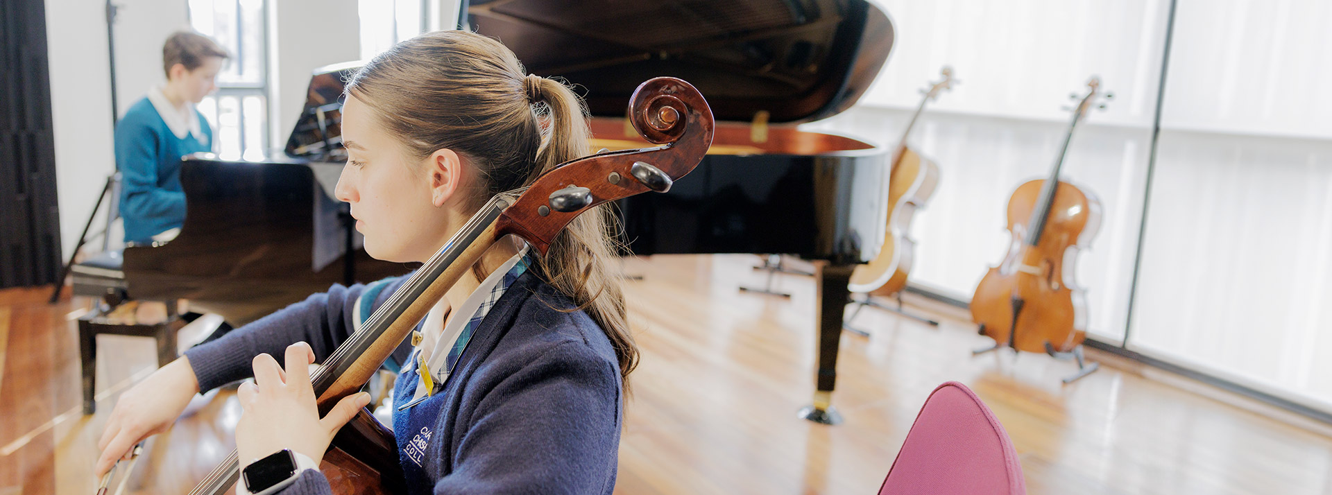 Creative arts at Caroline Chisholm Catholic College Glenmore Park. Student is playing violin.