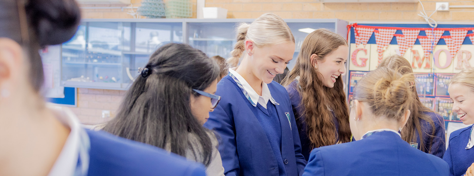 Caroline Chisholm Catholic College Glenmore Park students standing around table