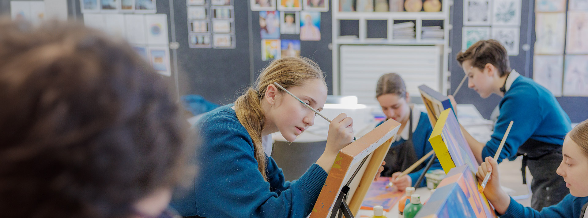 Art class at Caroline Chisholm Catholic College Glenmore Park. Students are painting