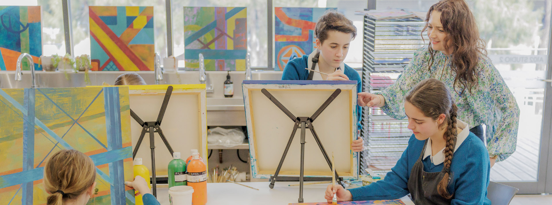 Art class at Caroline Chisholm Catholic College Glenmore Park. Students are painting on easels