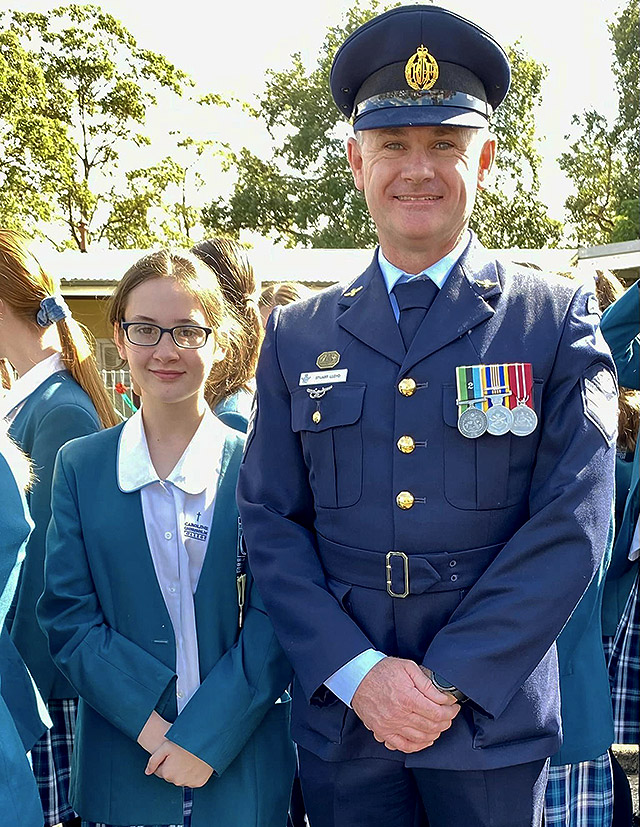 Caroline Chisholm Catholic College Glenmore Park student at ANZAC Day parade with father