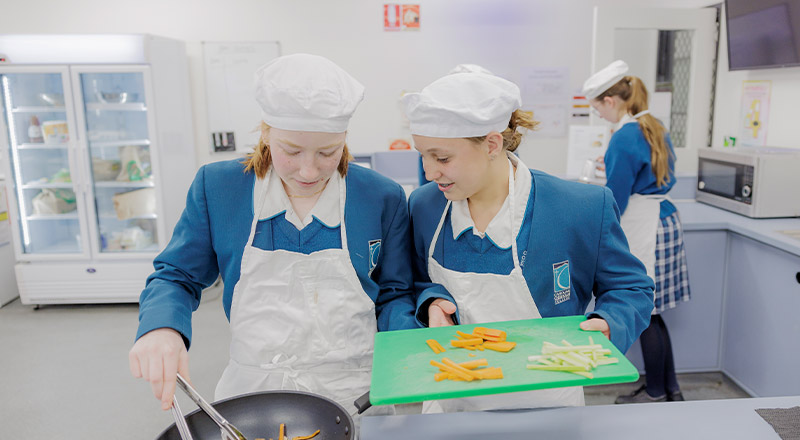 Caroline Chisholm Catholic College Glenmore Park student within hospitality setting