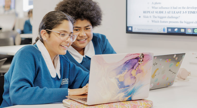Caroline Chisholm Catholic College Glenmore Park students using laptop together
