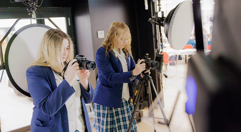 Caroline Chisholm Catholic College Glenmore Park students in photography studio using cameras
