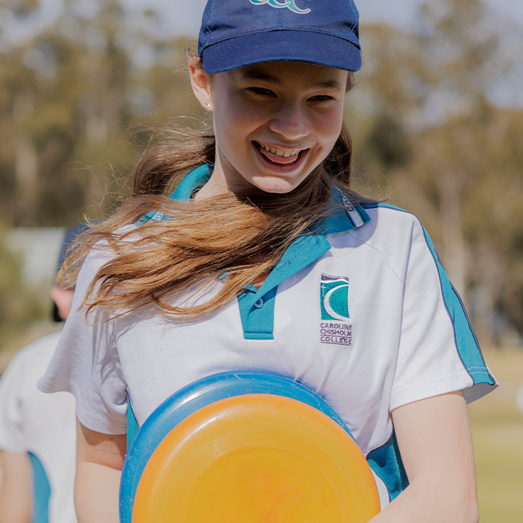 Caroline Chisholm Catholic College Glenmore Park student playing frisbee