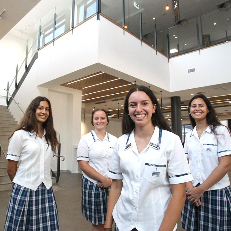 Caroline Chisholm Catholic College Glenmore Park students standing in refurbished building